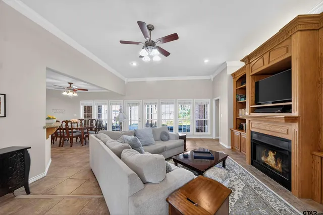 a living room with furniture fireplace and flat screen tv