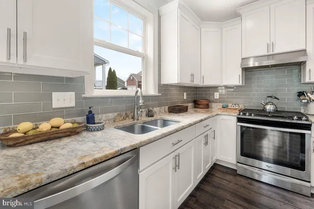 a kitchen with sink cabinets and window