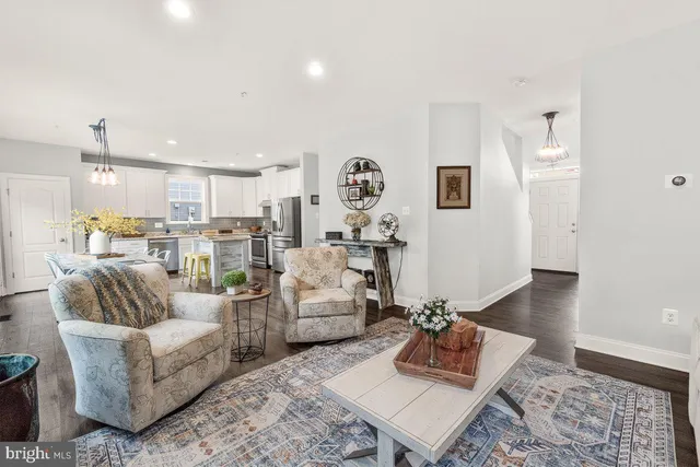 a living room with furniture and a rug