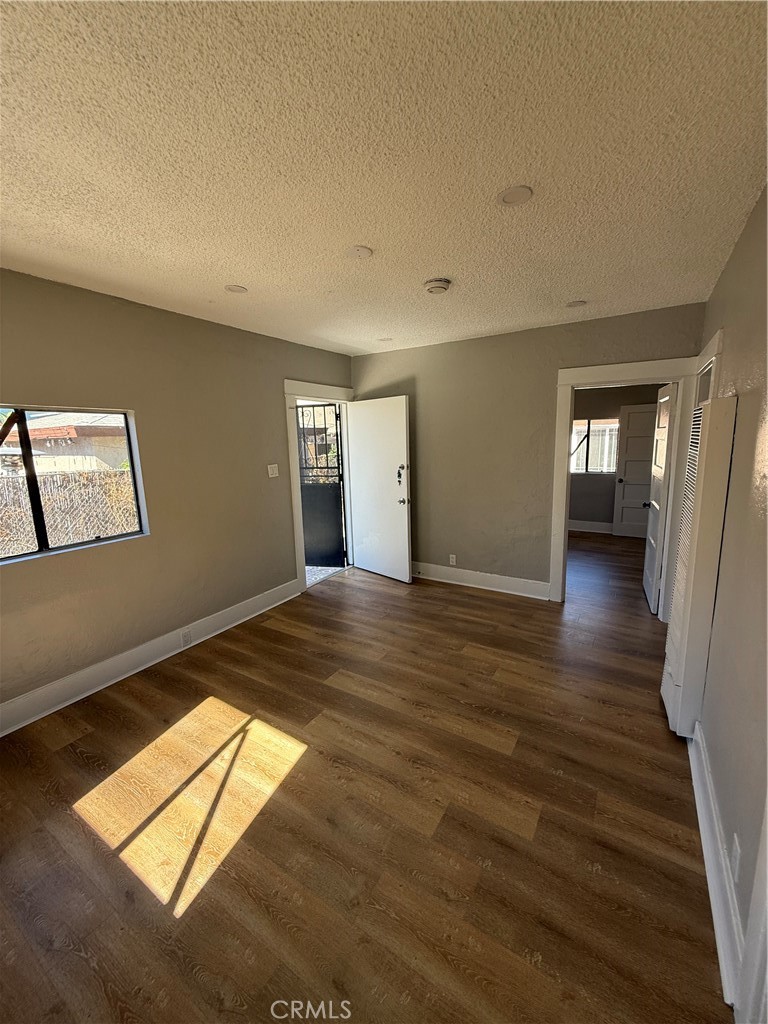 2853 East 6th Street, Unit 2 Los Angeles, CA 90023 - Photo 11 of 14 a view of an empty room and window