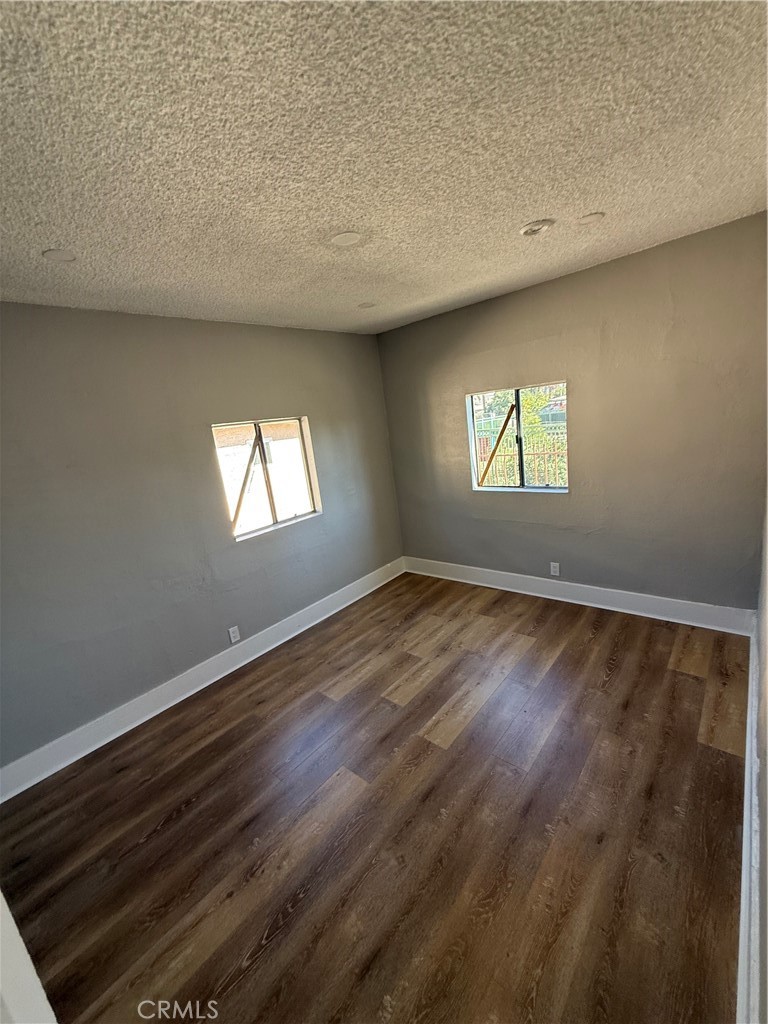 2853 East 6th Street, Unit 2 Los Angeles, CA 90023 - Photo 4 of 14 an empty room with windows
