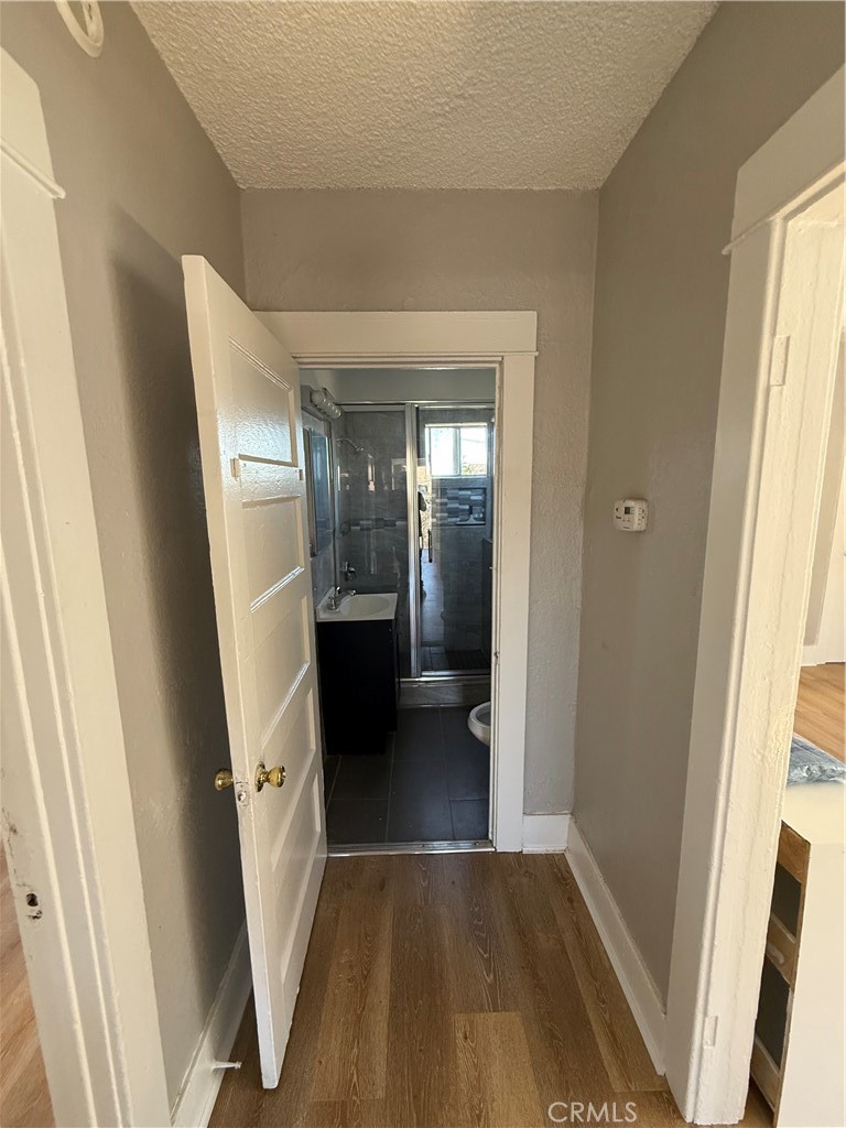 2853 East 6th Street, Unit 2 Los Angeles, CA 90023 - Photo 8 of 14 a view of a hallway view with wooden floor and staircase