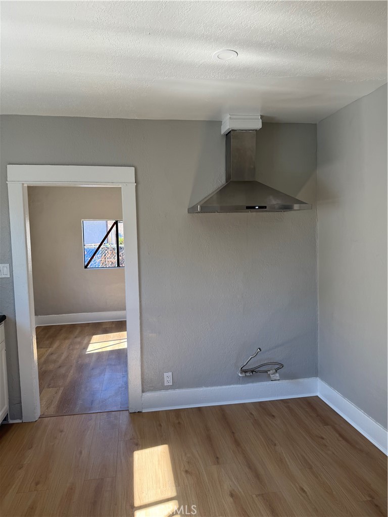 2853 East 6th Street, Unit 2 Los Angeles, CA 90023 - Photo 10 of 14 a view of empty room with wooden floor