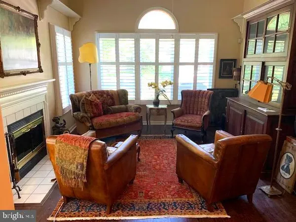 a kitchen with stainless steel appliances granite countertop a refrigerator a stove a sink dishwasher with a dining table and chairs