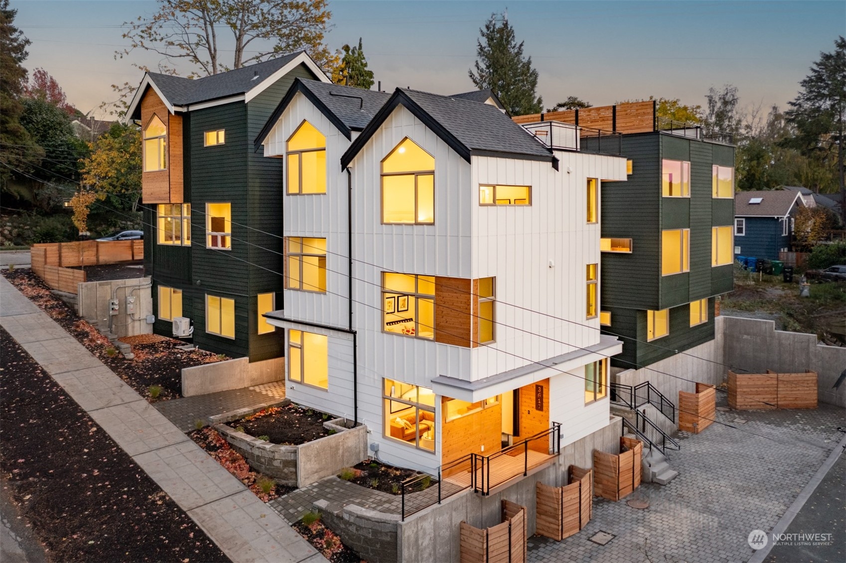 3617 South Hanford Street Seattle, WA 98144 - Photo 31 of 32 a front view of a residential apartment building with a yard