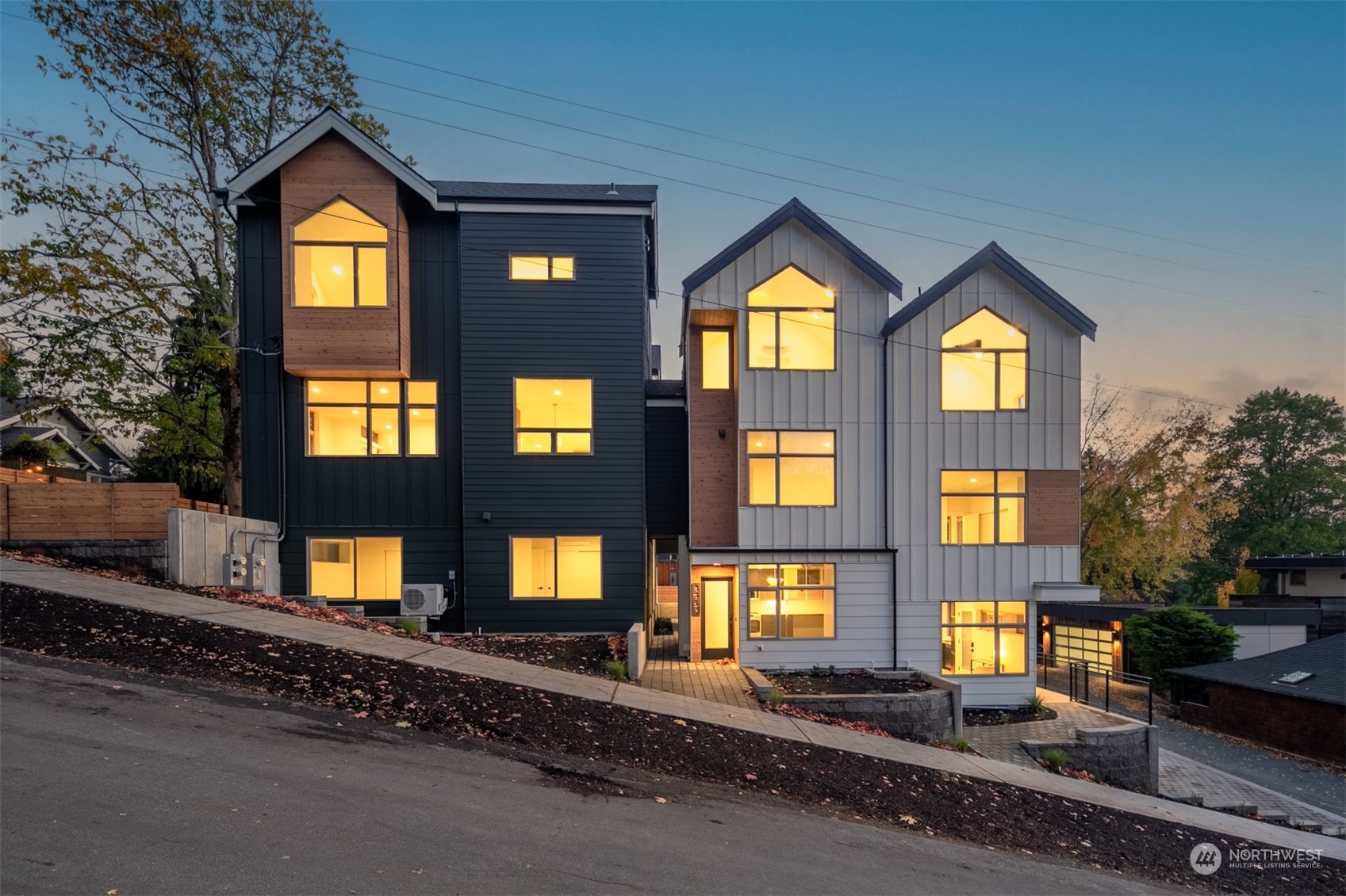 3617 South Hanford Street Seattle, WA 98144 - Photo 32 of 32 a front view of a residential apartment building with a yard
