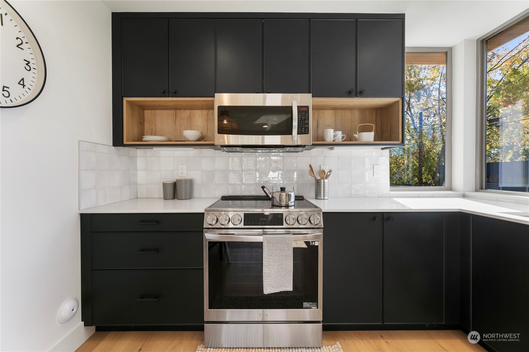 3617 South Hanford Street Seattle, WA 98144 - Photo 6 of 32 a kitchen with a stove and a microwave
