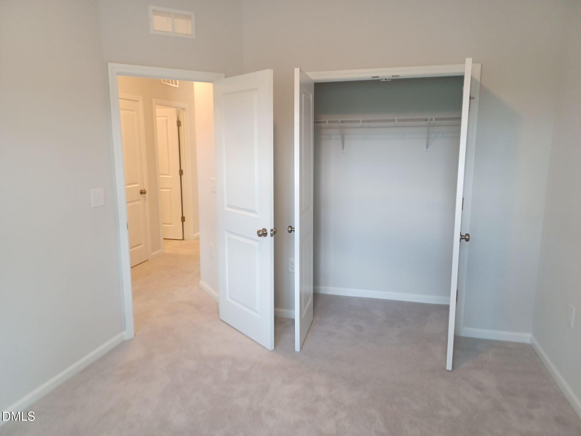 6079 Beale Loop Raleigh, NC 27616 - Photo 16 of 22 an empty room with closet