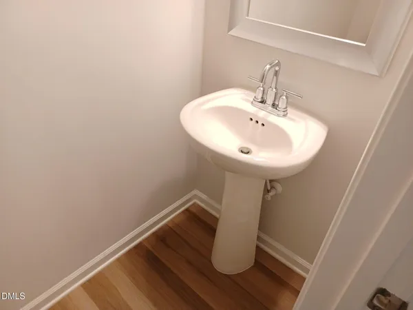 a bathroom with a sink and mirror