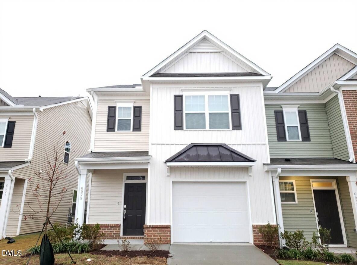 6079 Beale Loop Raleigh, NC 27616 - Photo 22 of 22 a front view of a house with a yard