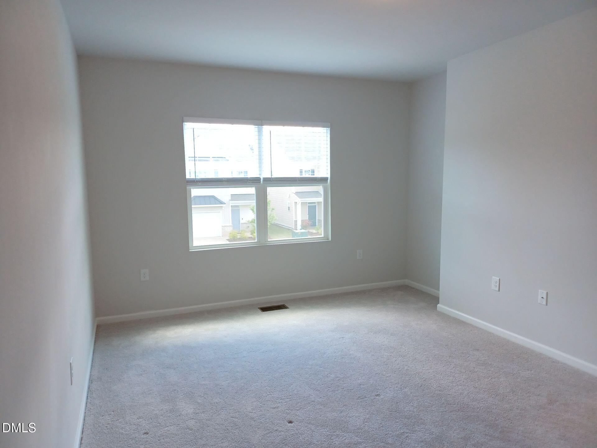 6079 Beale Loop Raleigh, NC 27616 - Photo 9 of 22 an empty room with a window