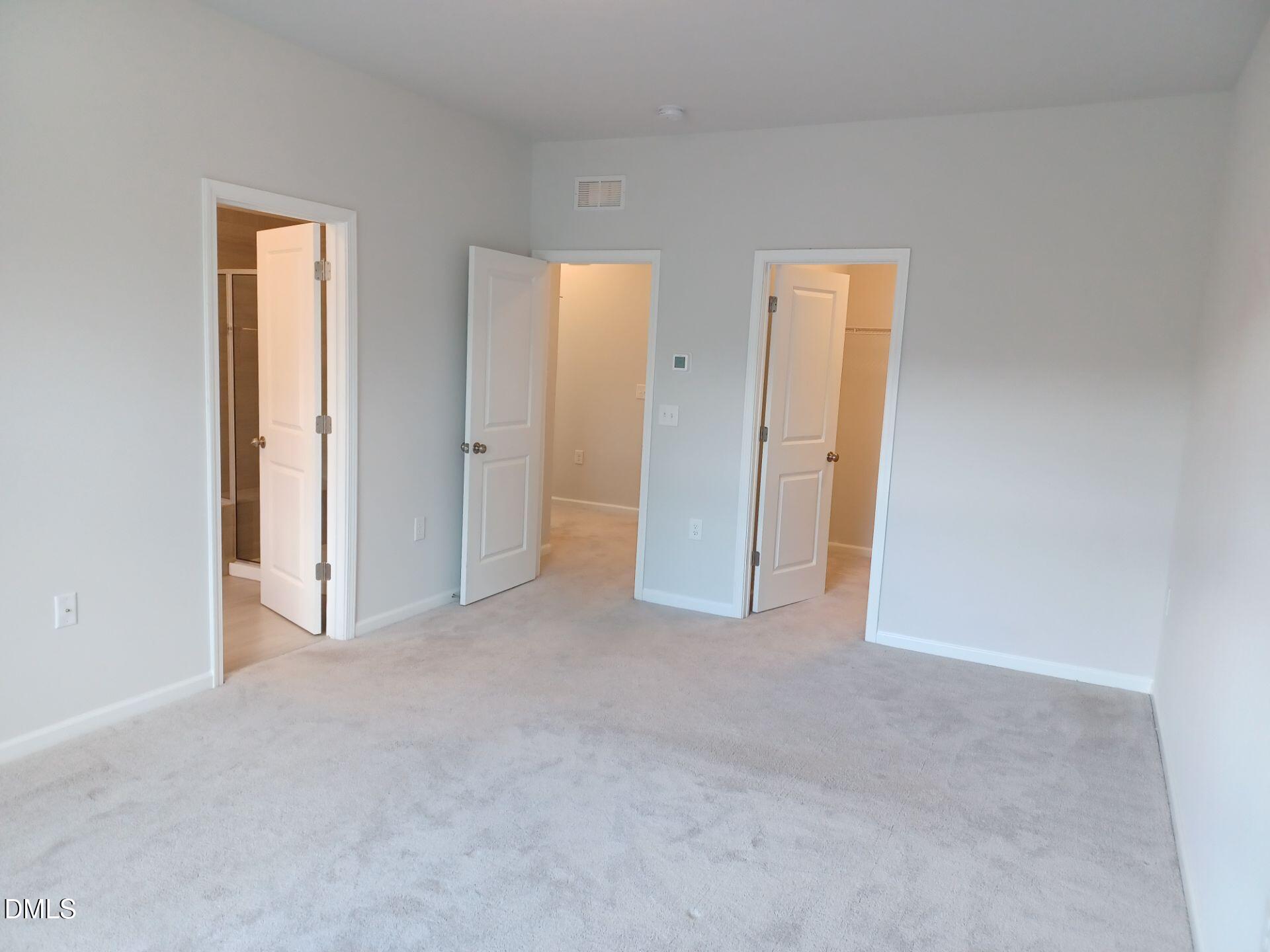 6079 Beale Loop Raleigh, NC 27616 - Photo 10 of 22 an empty room with windows and closet