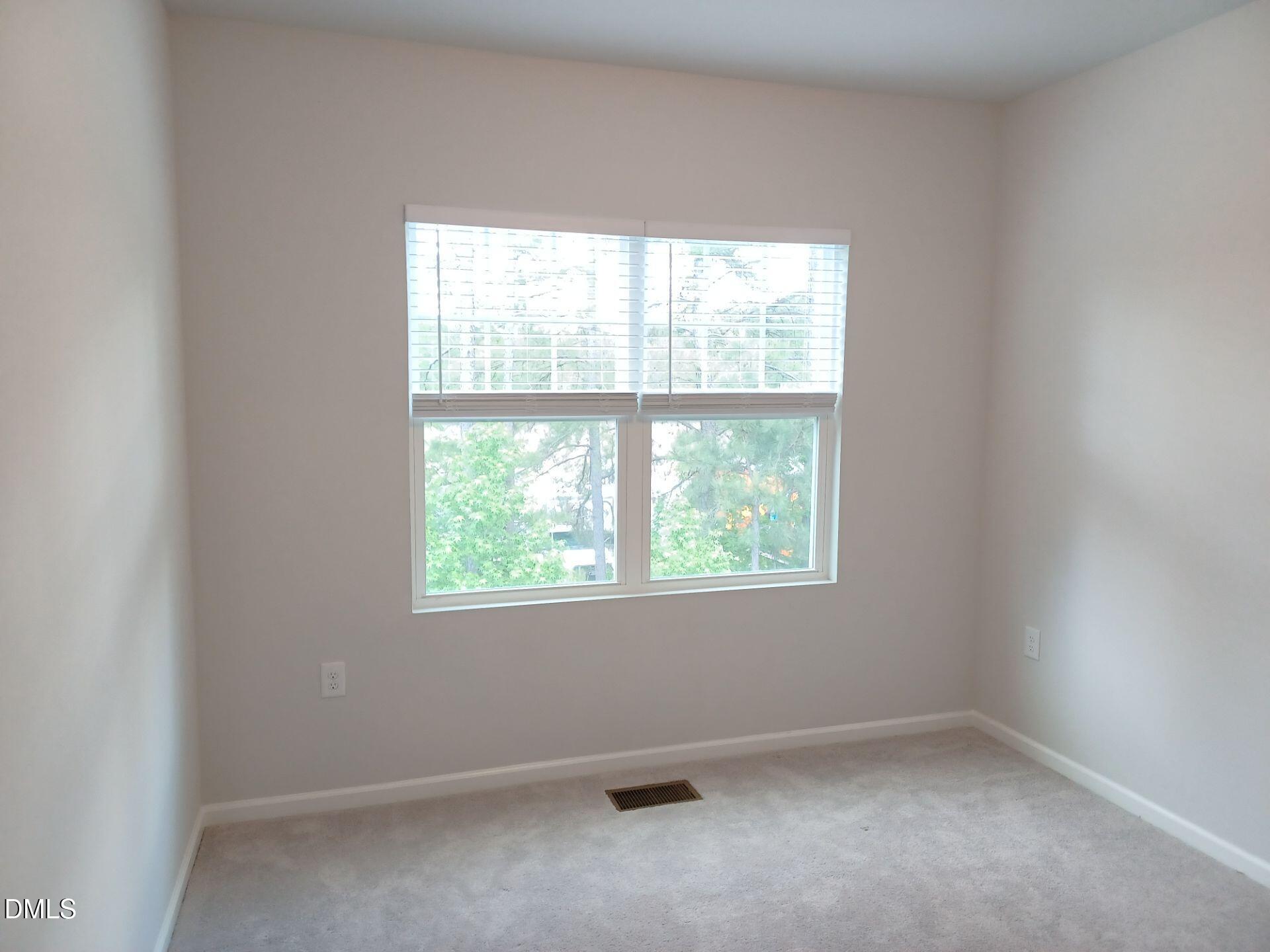6079 Beale Loop Raleigh, NC 27616 - Photo 10 of 22 an empty room with a window