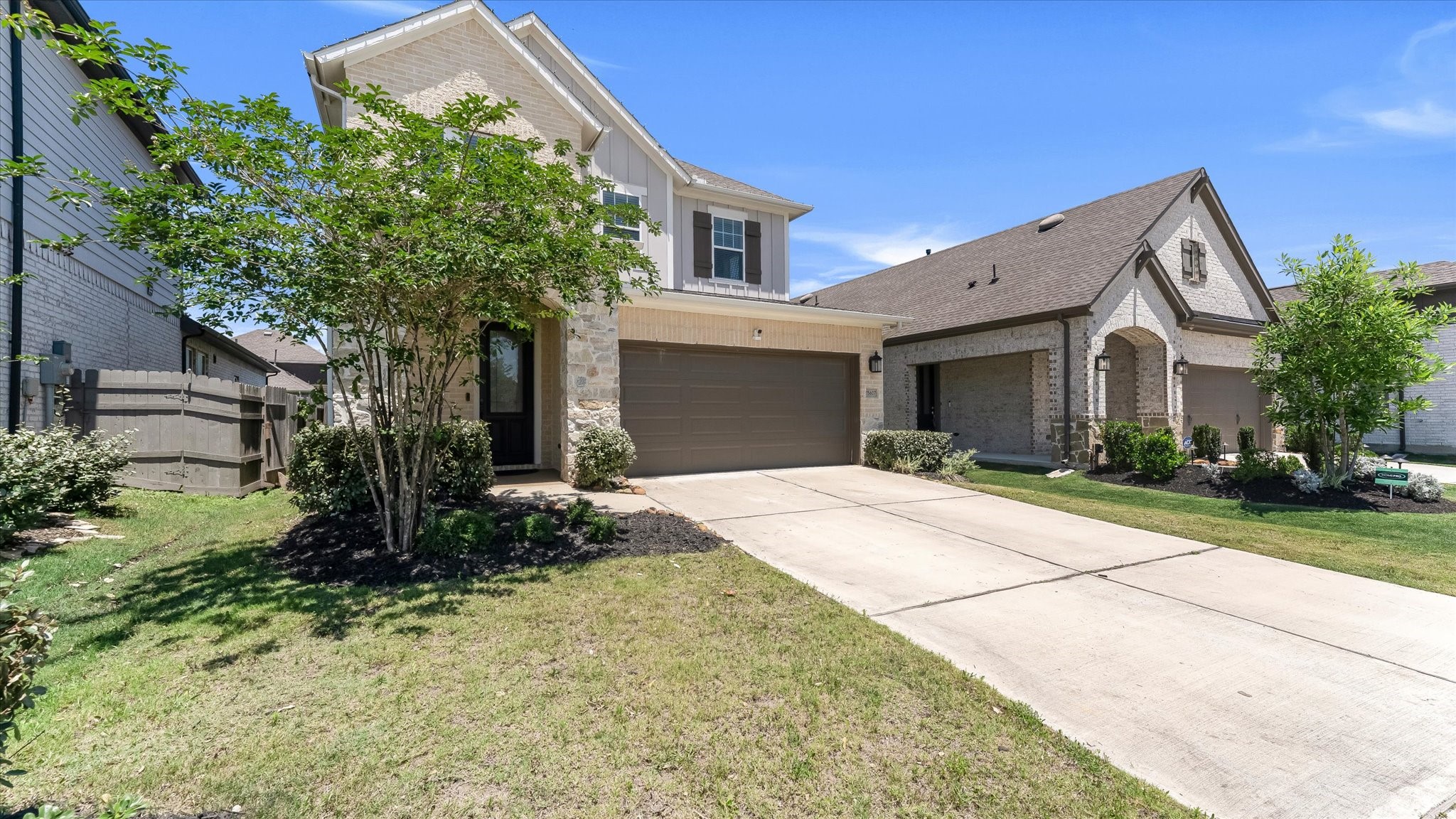15607 Rising Wren Court Conroe, TX 77302 - Photo 3 of 40 a front view of a house with a yard