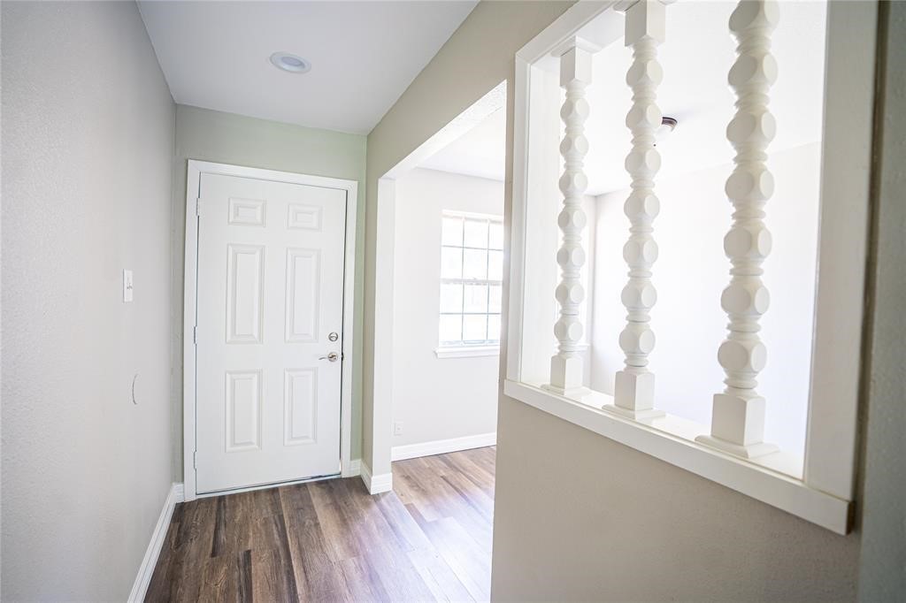 7130 Heath Street Houston, TX 77016 - Photo 18 of 18 a view of an empty room with wooden floor and a window