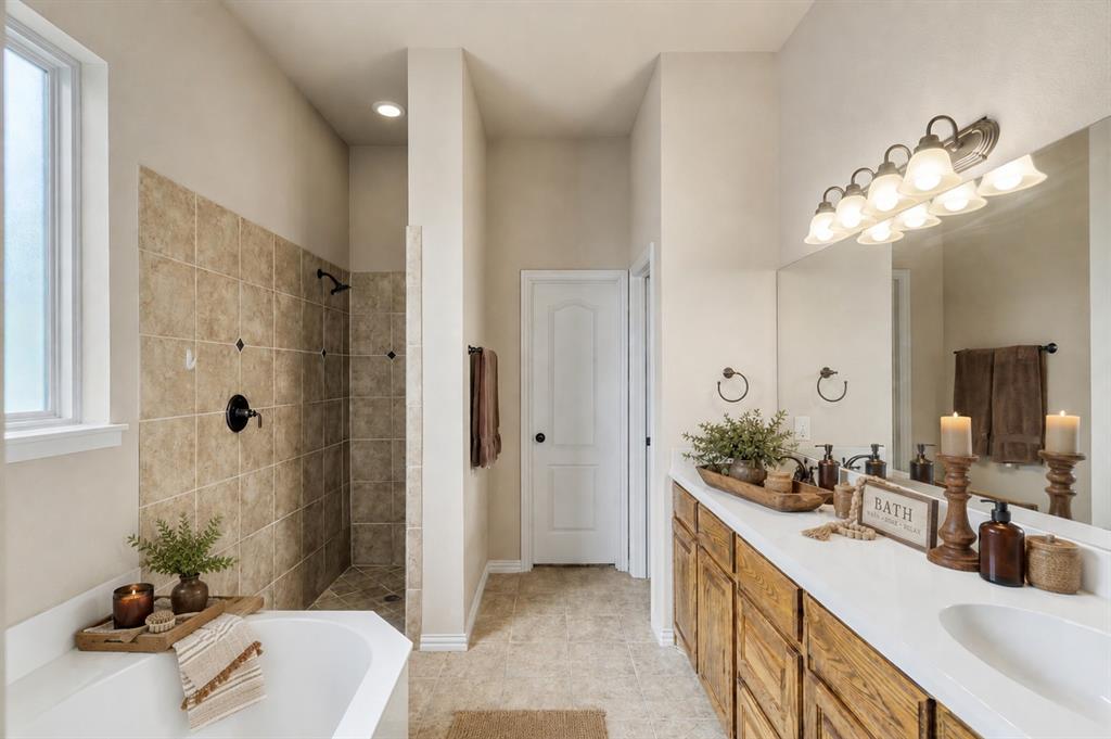 1852 Meadowview Canton, TX 75103 - Photo 17 of 28 a bathroom with a double vanity sink and a mirror
