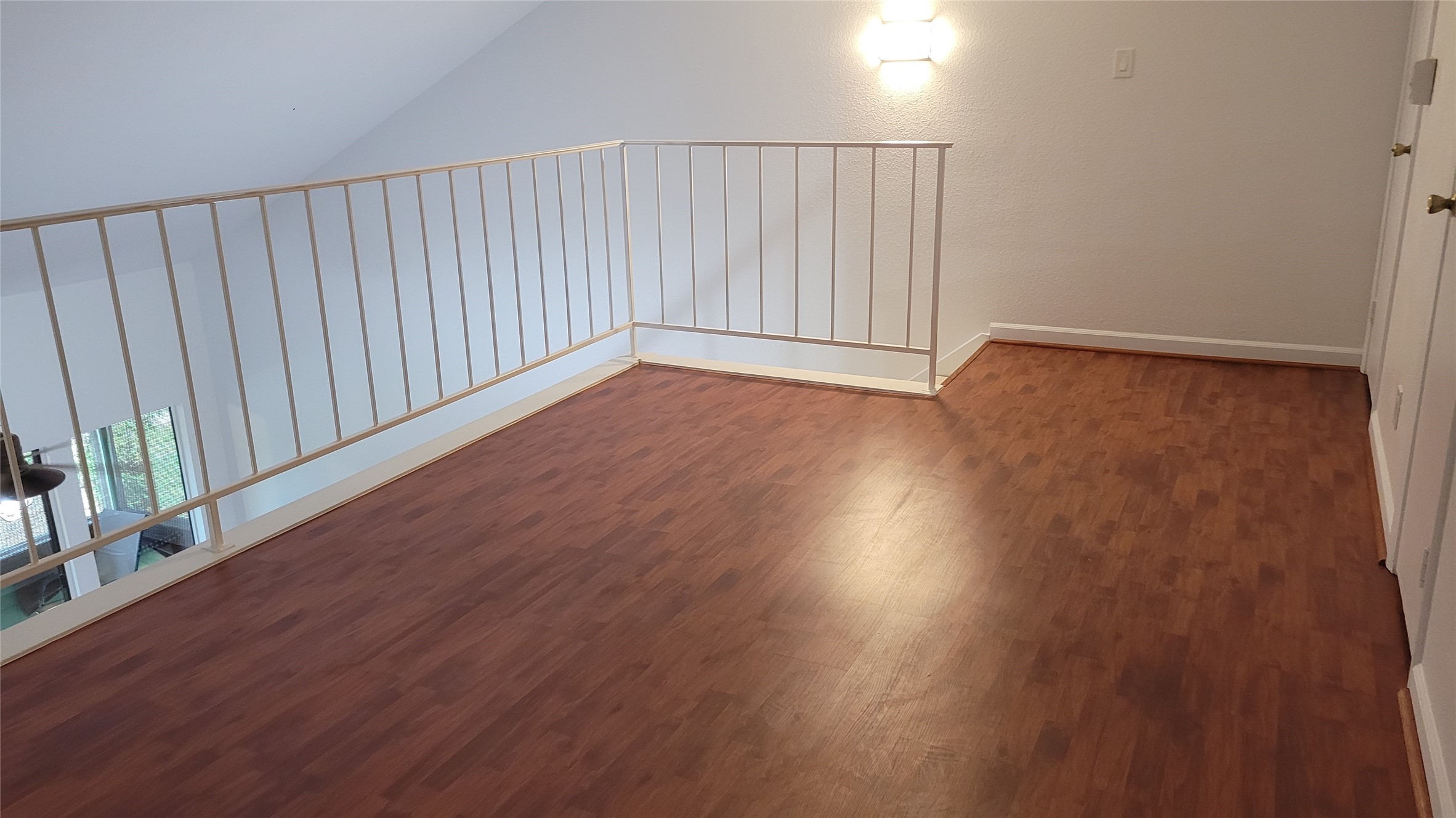 14777 Wunderlich Drive, Unit 112 Houston, TX 77069 - Photo 22 of 23 an empty room with wooden floor and windows