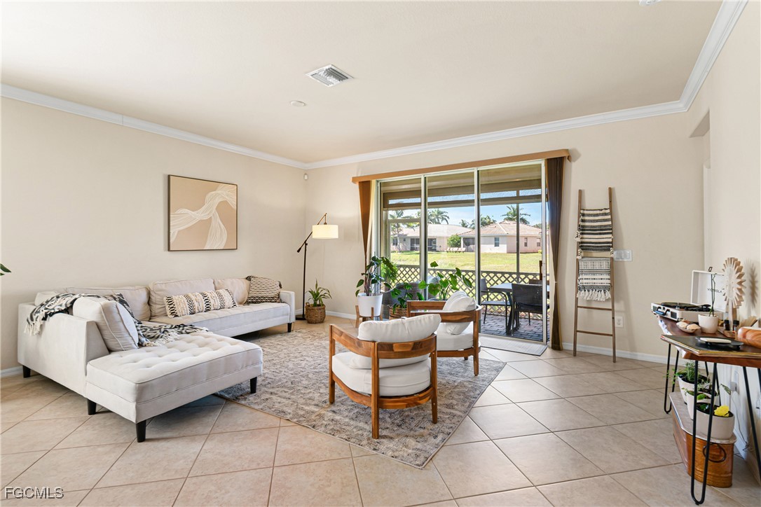 11656 Eros Road Lehigh Acres, FL 33971 - Photo 17 of 49 a living room with furniture and a window