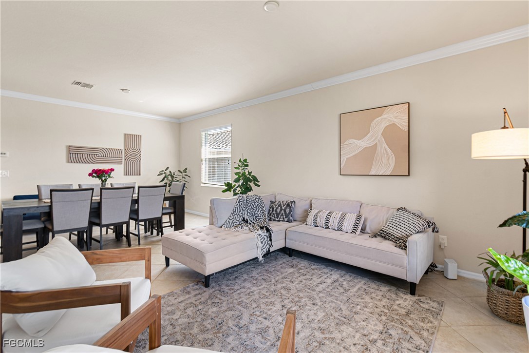 11656 Eros Road Lehigh Acres, FL 33971 - Photo 21 of 49 a living room with furniture and a couch