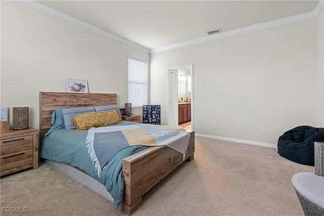 a bedroom with a bed and a lamp with window