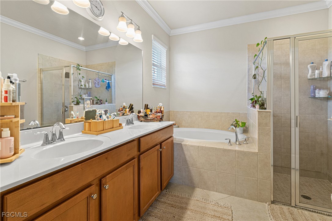 11656 Eros Road Lehigh Acres, FL 33971 - Photo 27 of 49 a bathroom with a tub sink and mirror