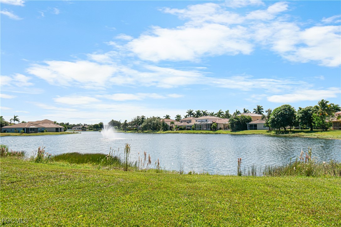 11656 Eros Road Lehigh Acres, FL 33971 - Photo 41 of 49 a view of a lake next to a lake