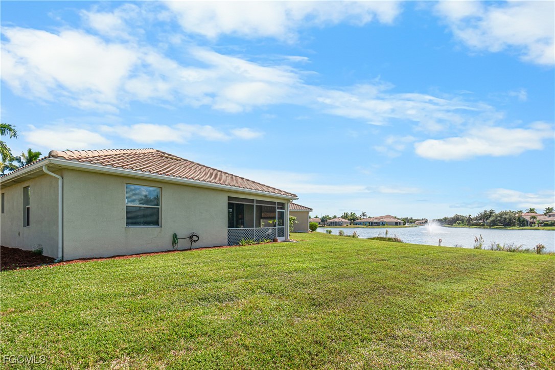 11656 Eros Road Lehigh Acres, FL 33971 - Photo 42 of 49 a view of a swimming pool with an outdoor seating