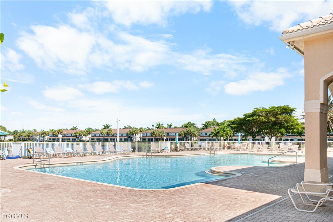 11656 Eros Road Lehigh Acres, FL 33971 - Photo 46 of 49 a view of a swimming pool and a yard