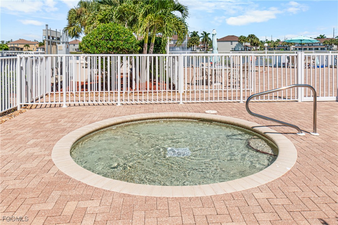 11656 Eros Road Lehigh Acres, FL 33971 - Photo 47 of 49 a view of a swimming pool with a garden