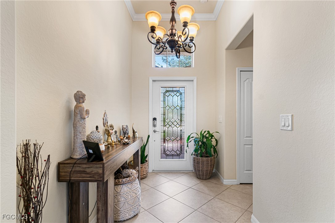 11656 Eros Road Lehigh Acres, FL 33971 - Photo 6 of 49 a view of a dining room with furniture and a potted plant