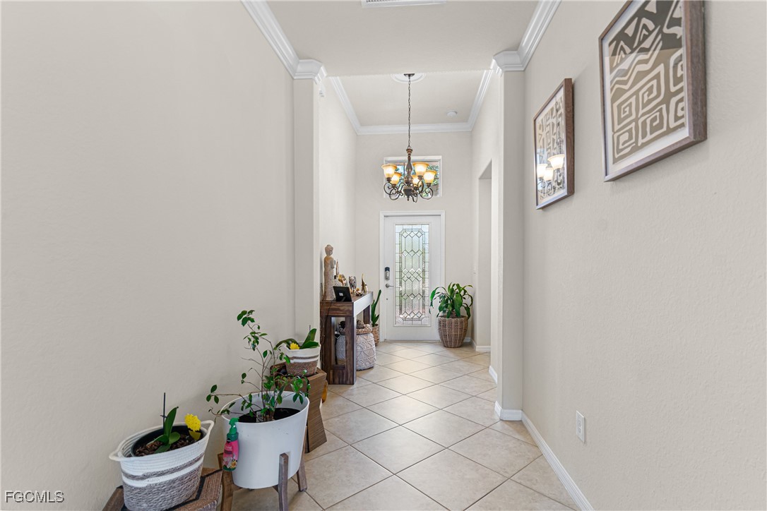 11656 Eros Road Lehigh Acres, FL 33971 - Photo 7 of 49 a dining room with furniture and a potted plant