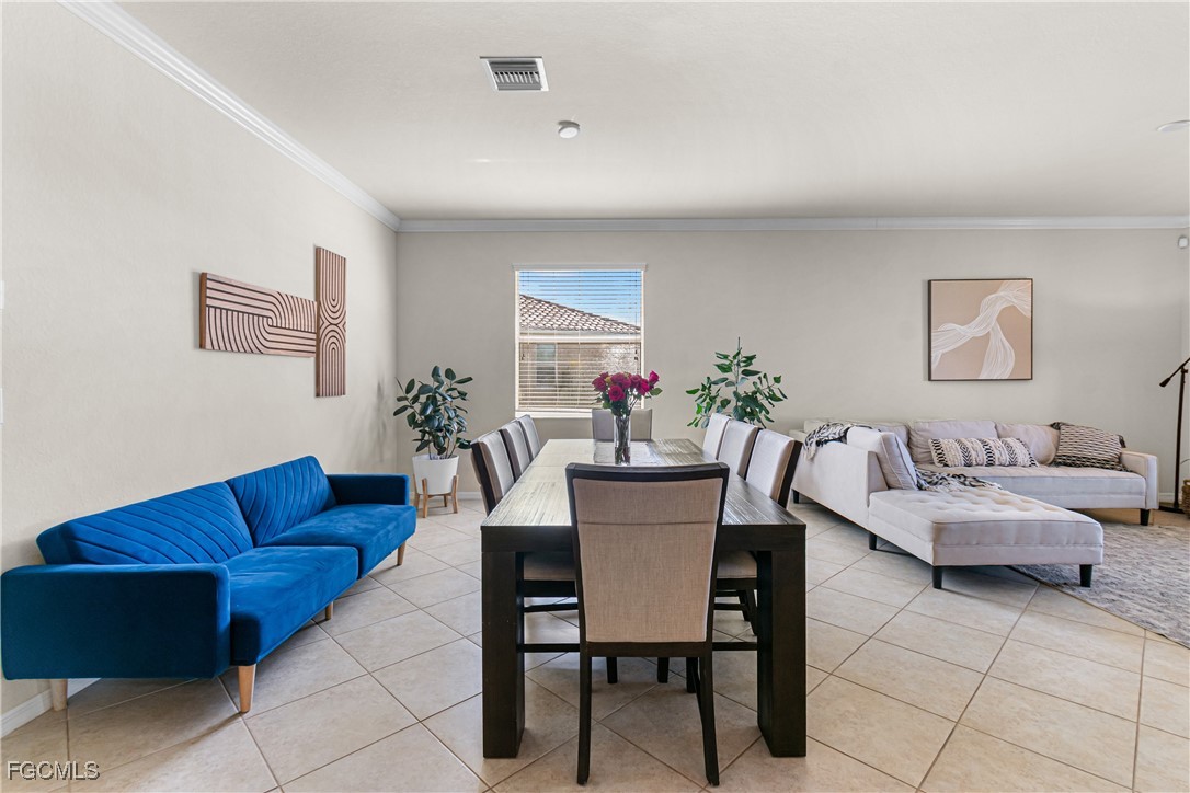 11656 Eros Road Lehigh Acres, FL 33971 - Photo 10 of 49 a view of a livingroom with furniture and a couch