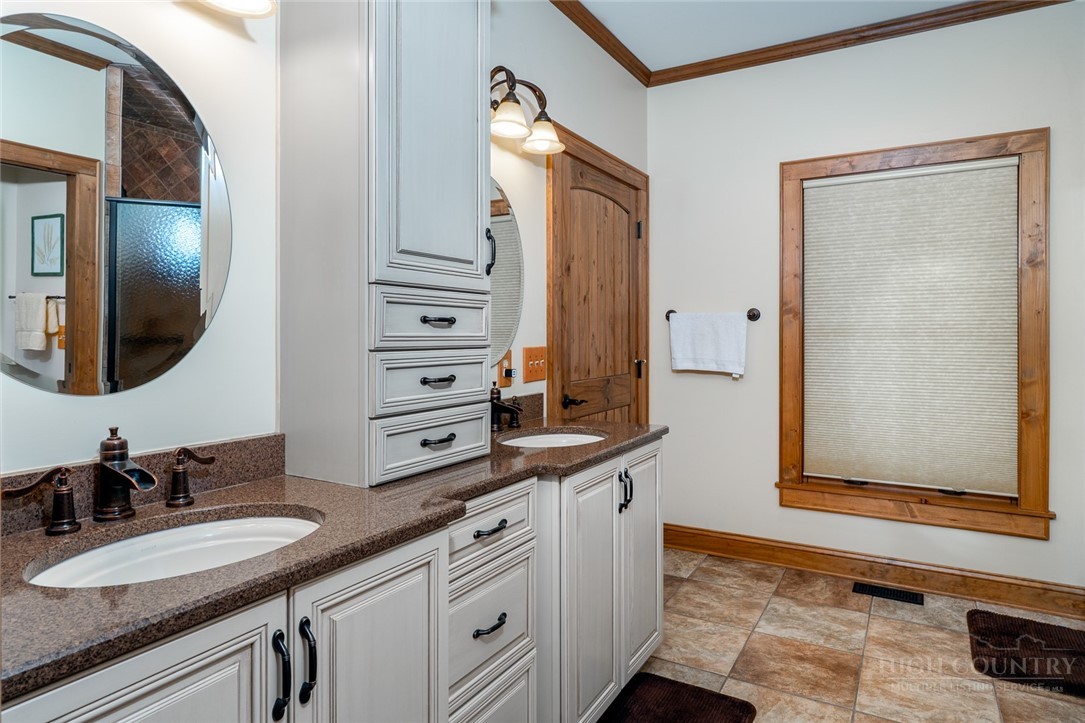 171 Camp Davis Road Banner Elk, NC 28604 - Photo 22 of 48 a bathroom with a granite countertop double vanity sink and mirror