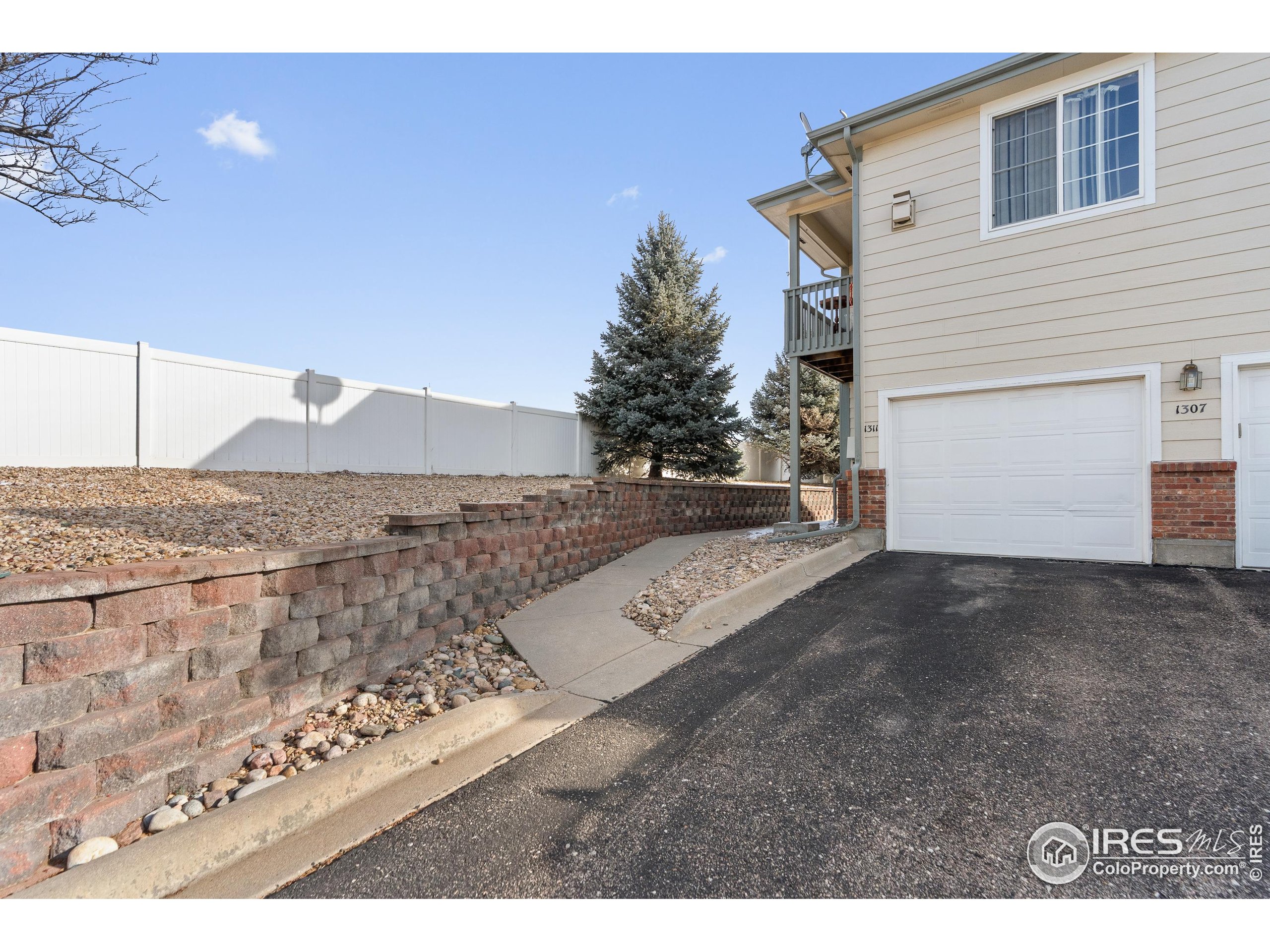 5151 29th Street, Unit 1311 Greeley, CO 80634 - Photo 15 of 16 a view of a house with a snow
