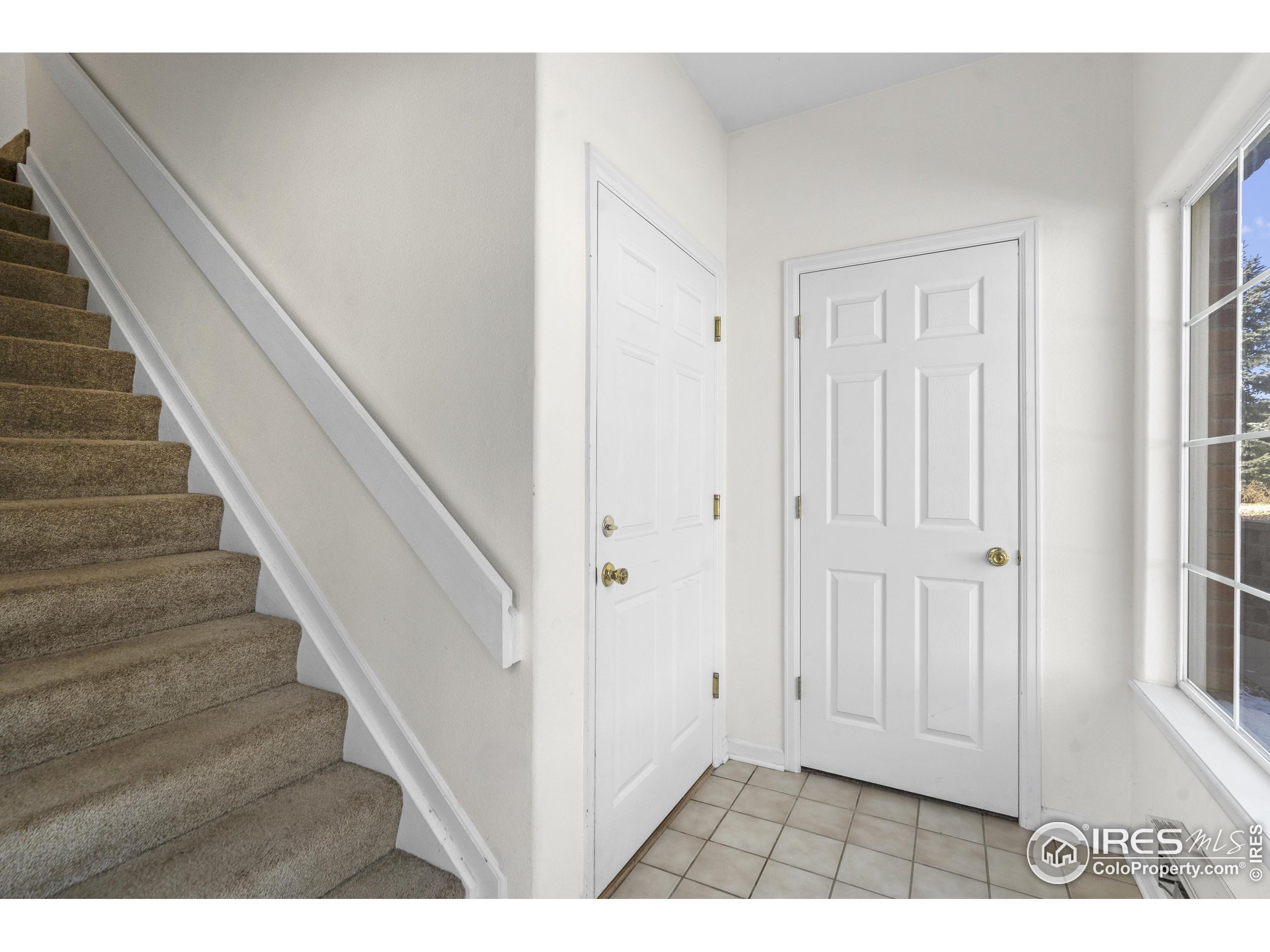 5151 29th Street, Unit 1311 Greeley, CO 80634 - Photo 3 of 16 a view of an entryway with staircase