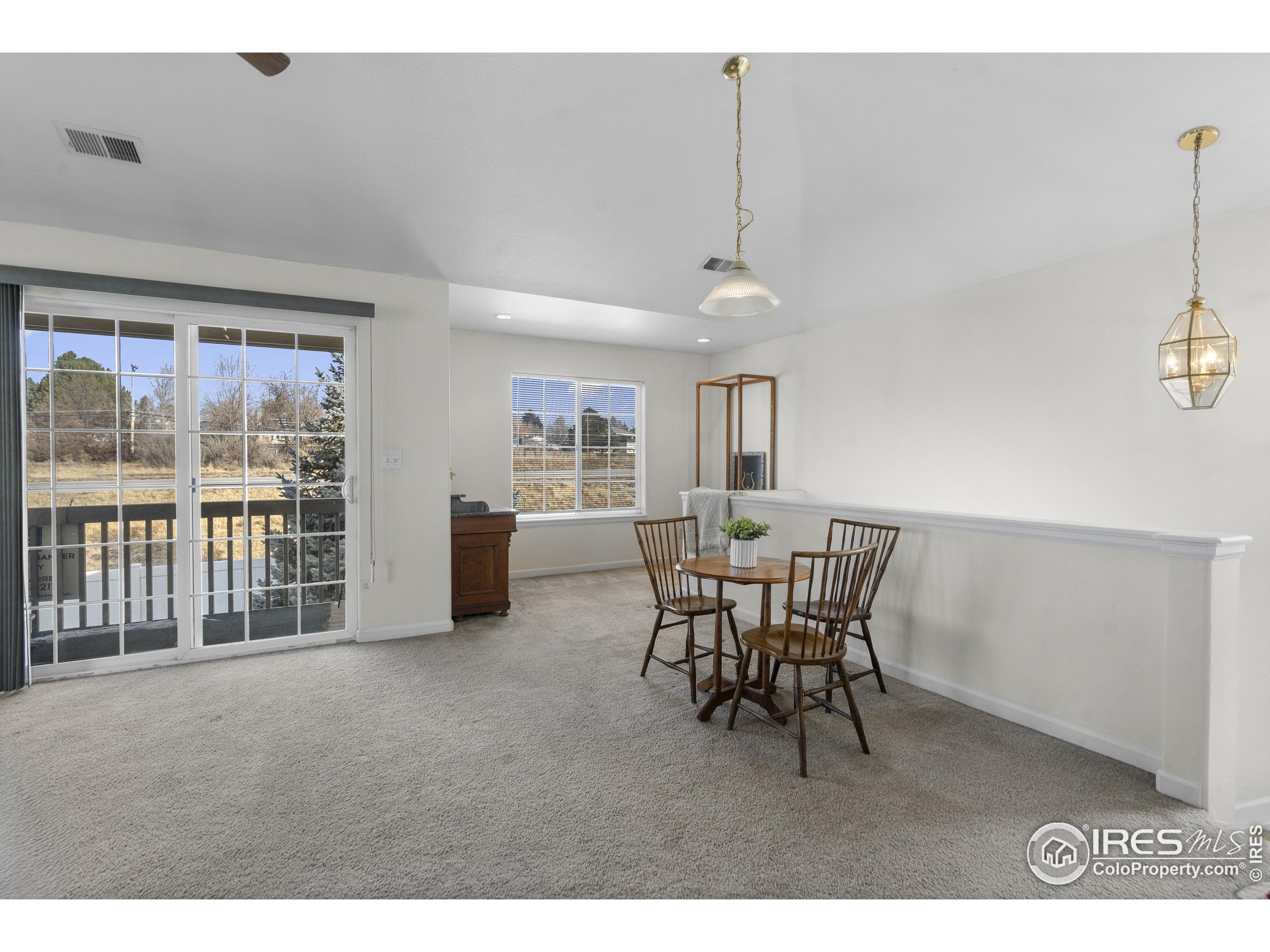 5151 29th Street, Unit 1311 Greeley, CO 80634 - Photo 5 of 16 a dining room with furniture and window
