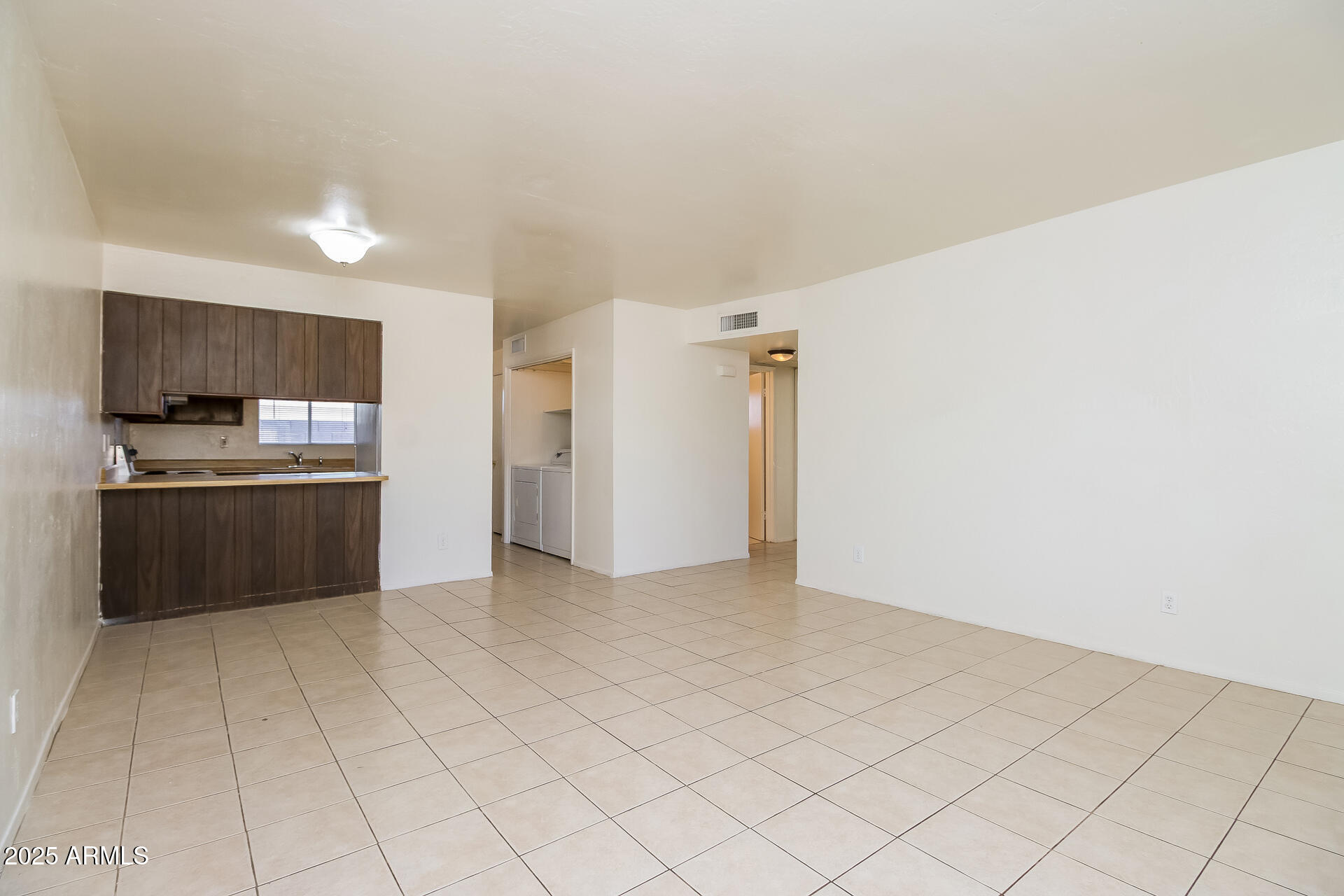 1326 North Miller Road, Unit B Tempe, AZ 85288 - Photo 2 of 11 a view of kitchen with refrigerator sink and cabinets