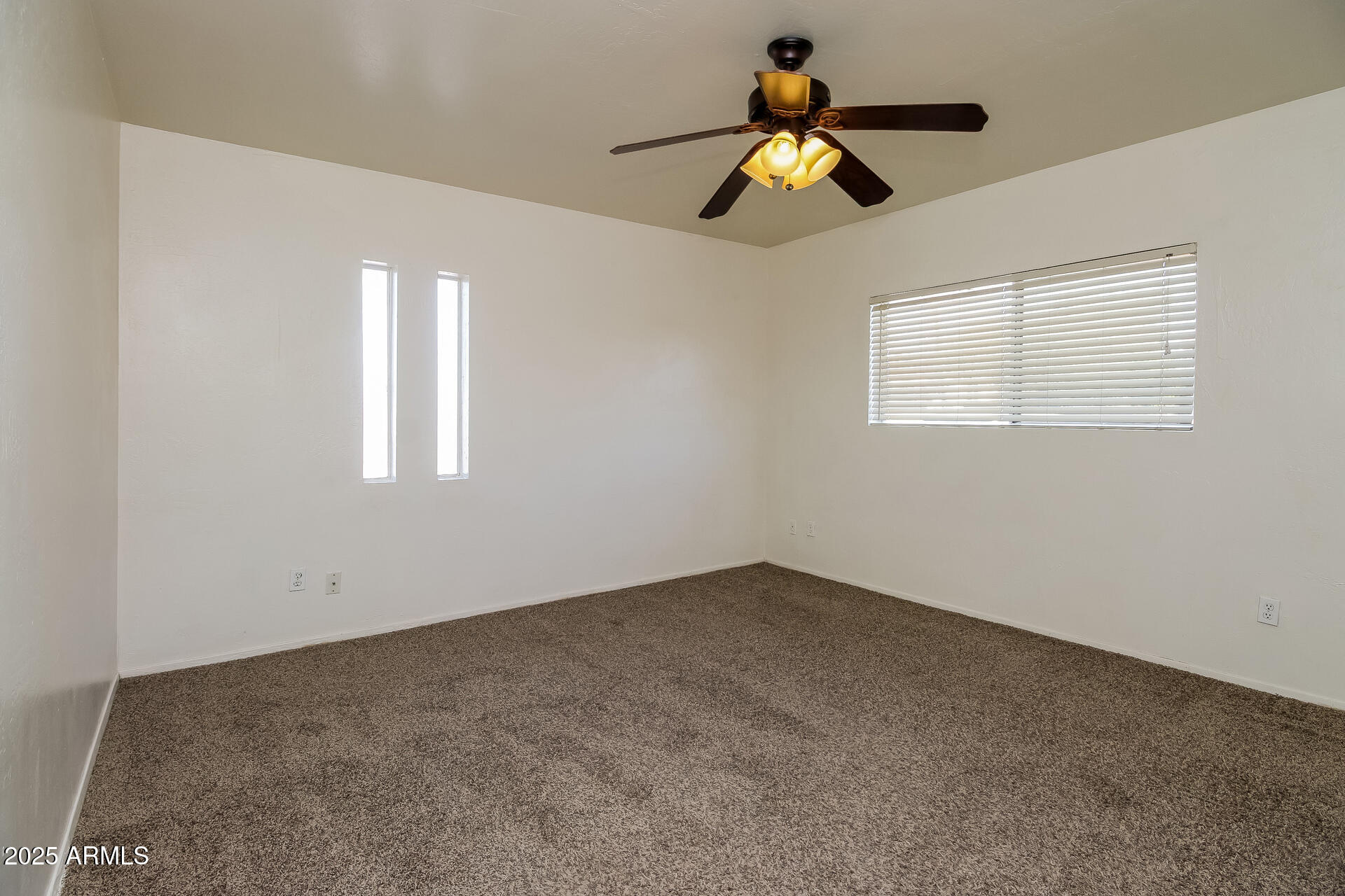 1326 North Miller Road, Unit B Tempe, AZ 85288 - Photo 7 of 11 a view of an empty room with a window