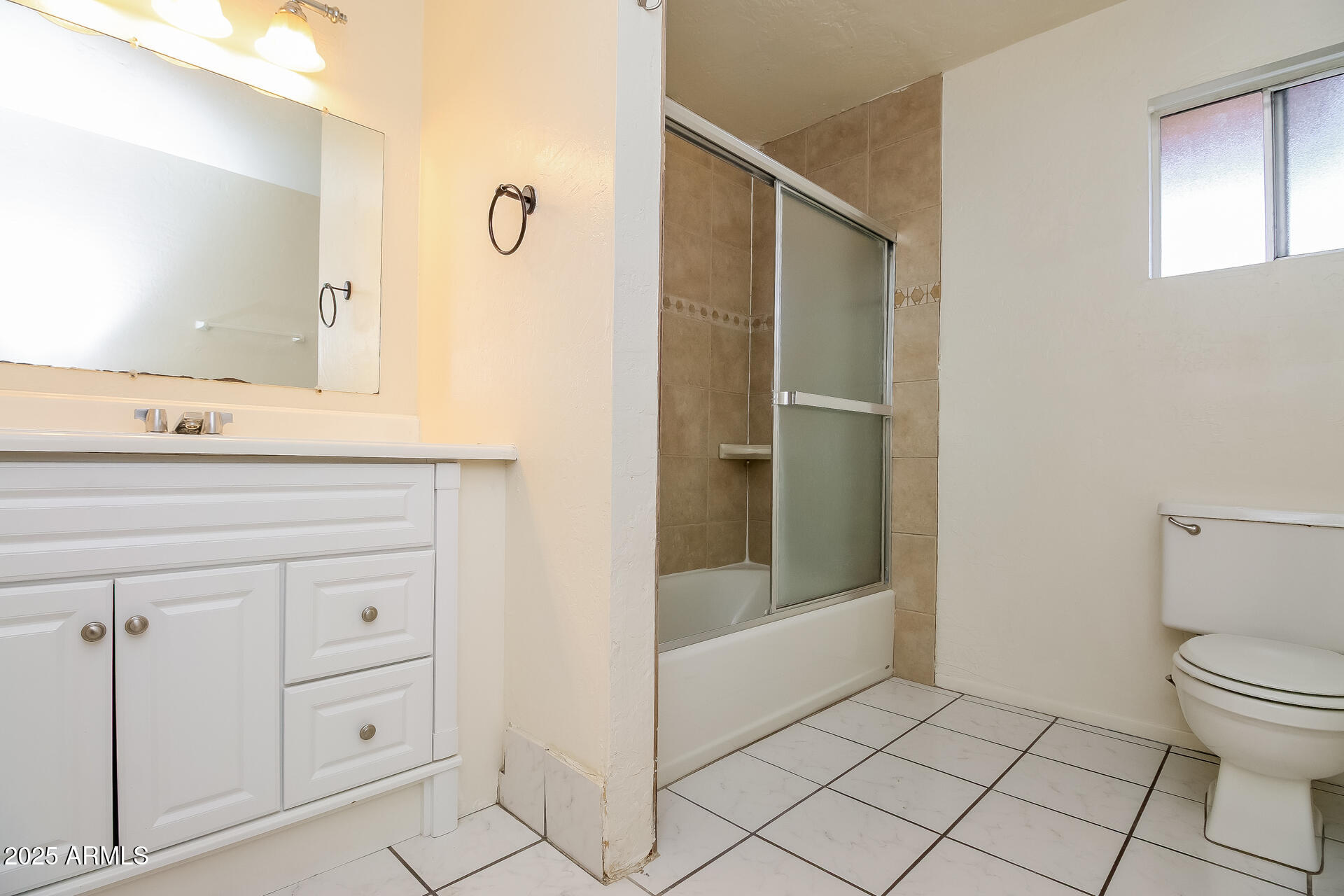 1326 North Miller Road, Unit B Tempe, AZ 85288 - Photo 8 of 11 a bathroom with a granite countertop sink mirror and toilet