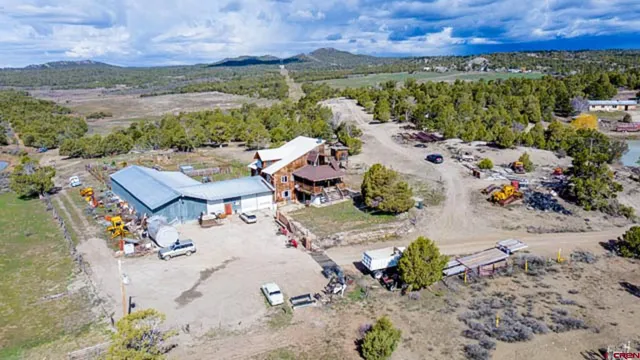 an aerial view of a house with a lake view