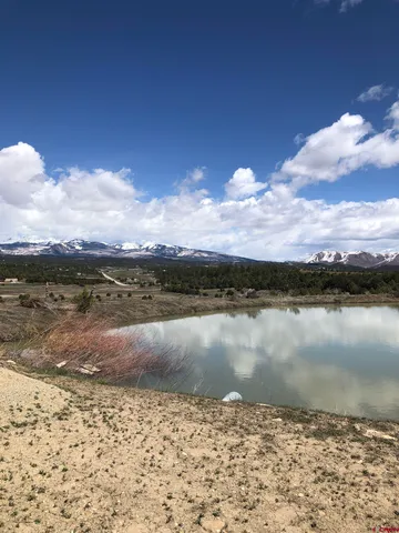 a view of an ocean and sunset