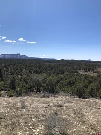 a view of a road with mountains in the background