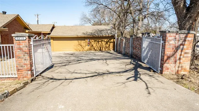 a view of a house with a snow on the road