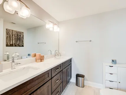a bathroom with a sink and shower