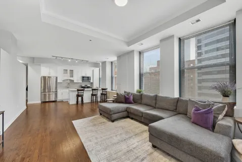 a living room with fireplace furniture and a flat screen tv