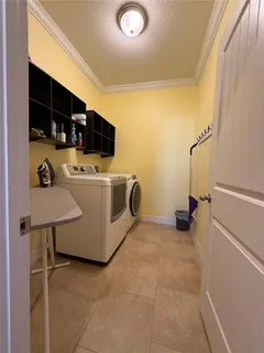 a view of a livingroom with furniture and front door