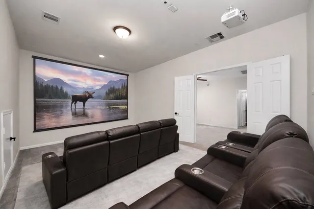 an aerial view of a house with yard swimming pool and outdoor seating