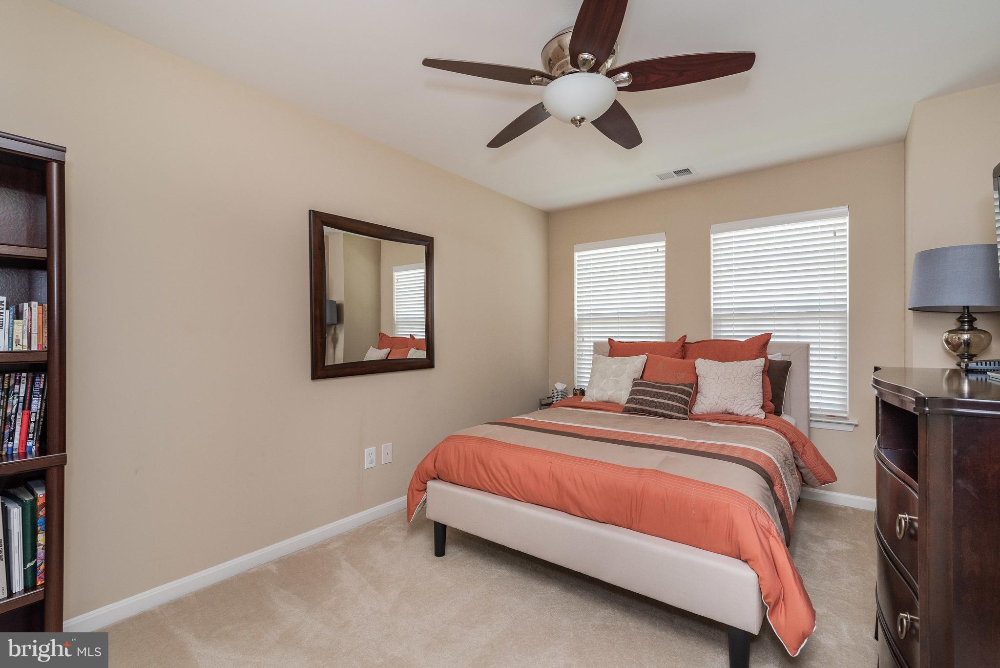 5926 Fairlee Road Elkridge, MD 21075 - Photo 22 of 27 a bedroom with a bed and a painting on the wall