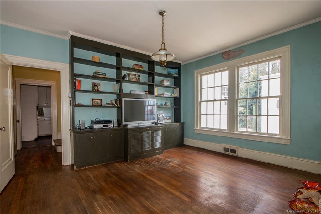 528 North Main Street Rutherfordton, NC 28139 - Photo 11 of 22 a kitchen with window and wooden floor
