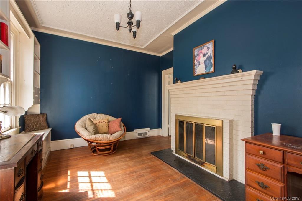 528 North Main Street Rutherfordton, NC 28139 - Photo 13 of 22 a living room with furniture a fireplace and a window